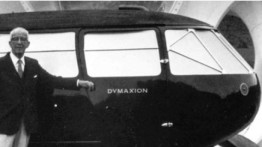 Buckminster Fuller standing next to his "Dymaxion" car