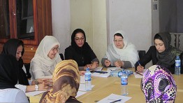 Ms. Mojadidi (in black with glasses) at the Women's Assembly Hall needs assessment meeting in Faryab province. 